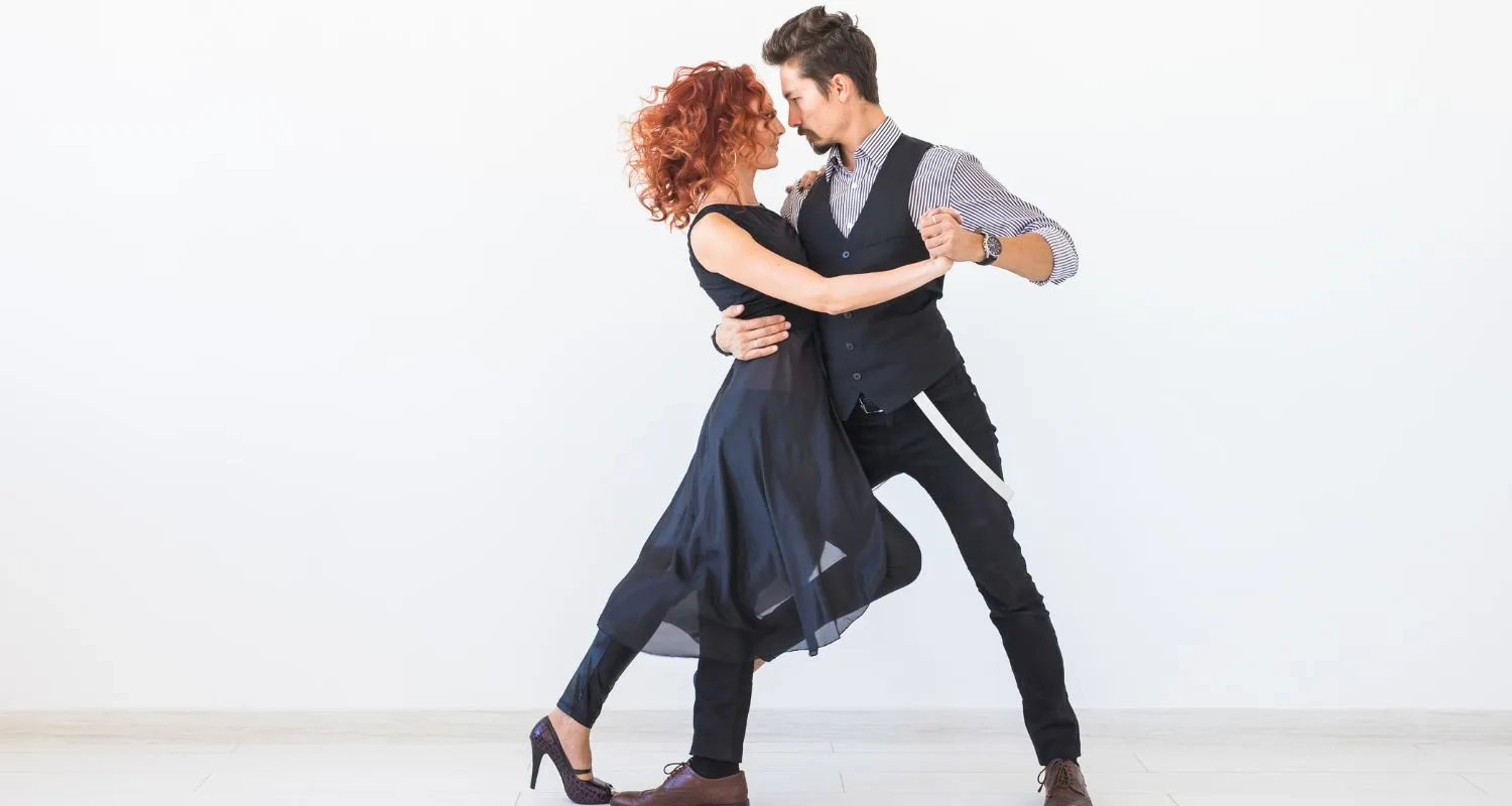 Couple dancing in closed hold during a partner dance lesson